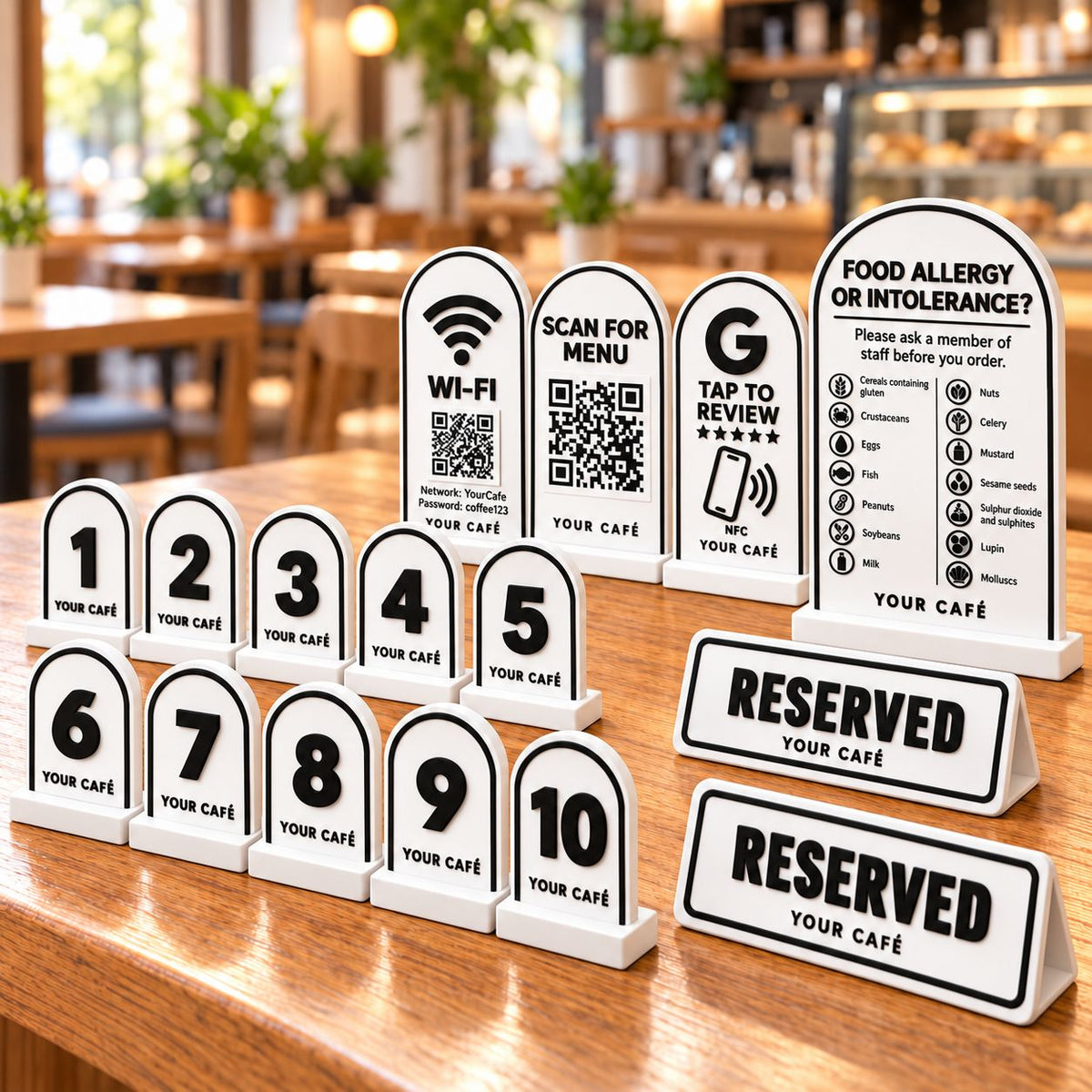 Café Starter Kit in white: personalised table numbers, Wi-Fi QR sign, scan-for-menu stand, review card, allergen notice and reserved signs