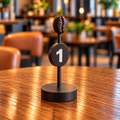 3D-printed coffee bean table number with a white number on a round plate